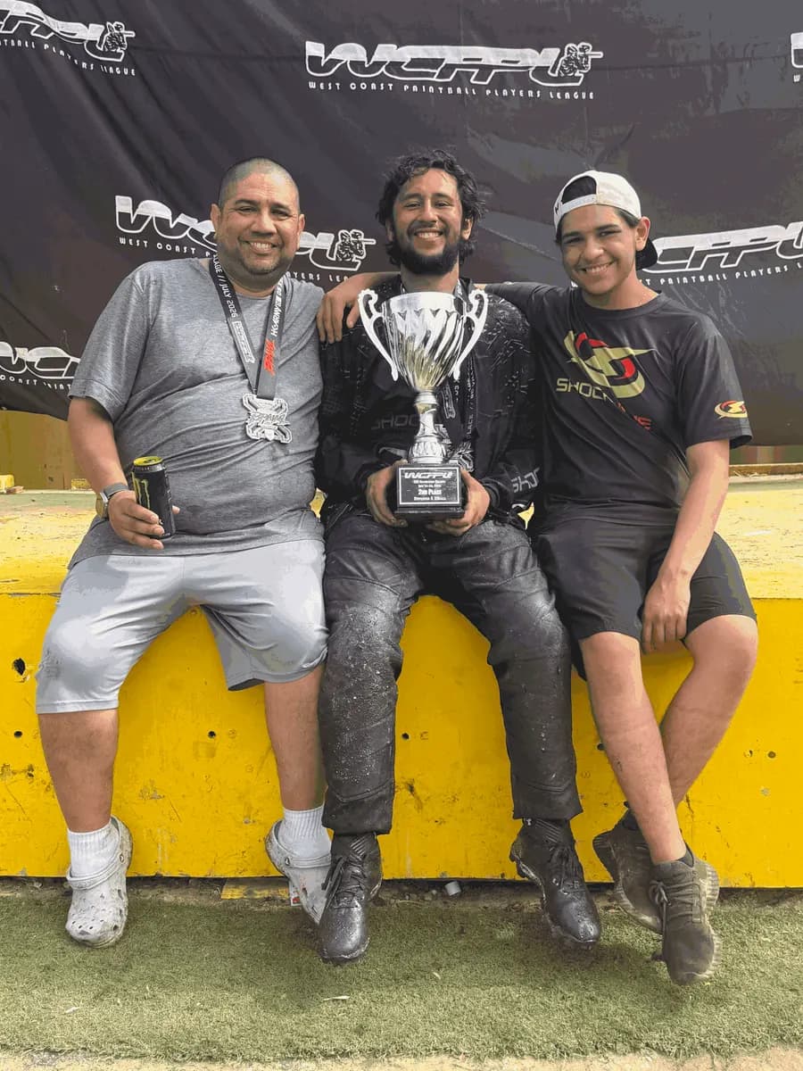 Jose with Summerlin Shockwave players holding a 2nd place Division 5 trophy at a West Coast Paintball Players League event